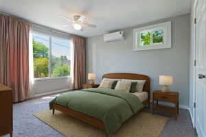 Bedroom with carpet, ceiling fan, and a wall mounted air conditioner