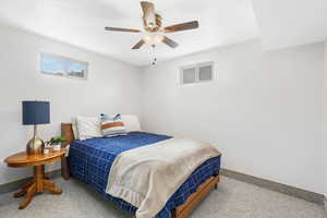 Bedroom with ceiling fan and baseboards