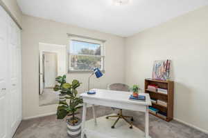 Office/3rd bedroom featuring light colored carpet