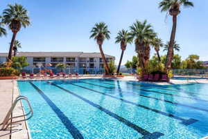 Community pool featuring a patio