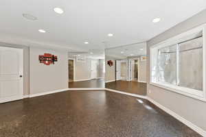 Empty room with recessed lighting and baseboards
