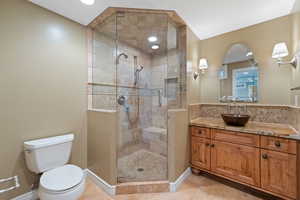 Full bath with vanity, a stall shower, light tile patterned flooring, and recessed lighting