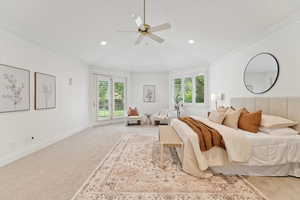 Carpeted bedroom with ornamental molding, recessed lighting, a ceiling fan, lofted ceiling, and access to outside