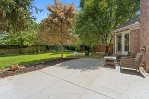 Fenced backyard with a patio