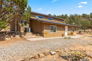 View of front of property featuring stucco siding and a patio