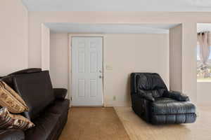 Sitting room with tile patterned flooring and baseboards
