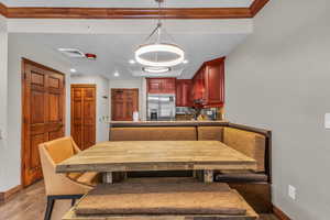 Dining area with recessed lighting, a textured wall, and breakfast area