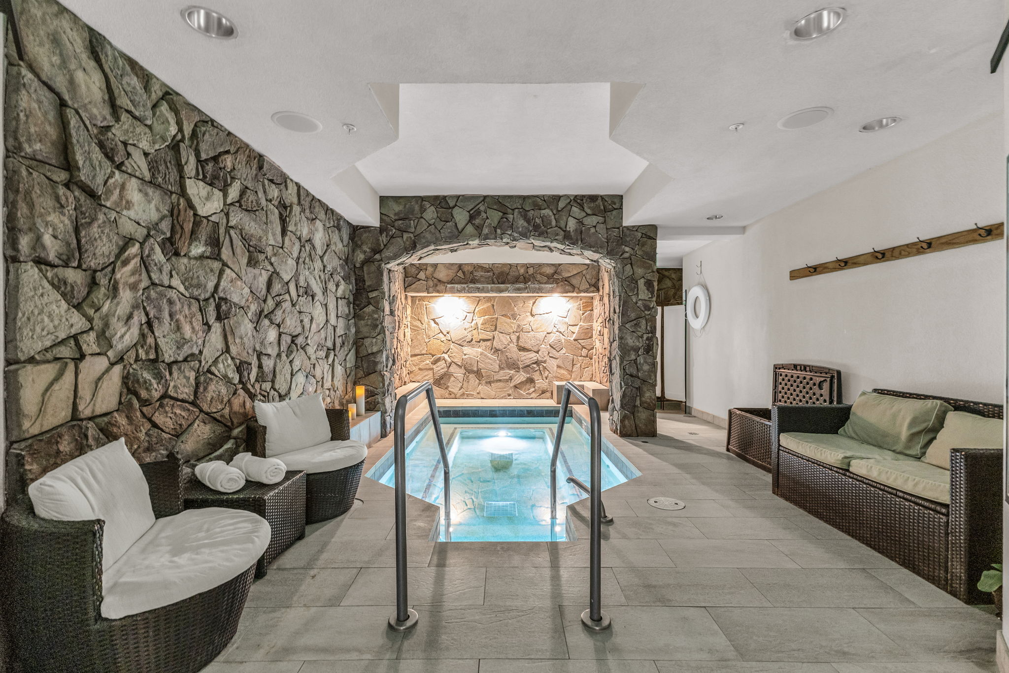 View of pool with a swimming pool and an in-ground hot tub