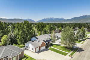 Aerial perspective of suburban area featuring a mountain backdrop