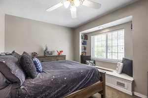 Bedroom featuring carpet and a ceiling fan