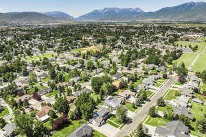 Aerial perspective of suburban area featuring a mountainous background