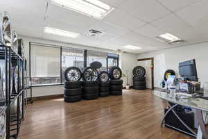 Office featuring a paneled ceiling and wood finished floors