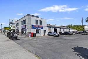 View of commercial location with uncovered parking