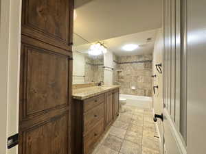 Full bathroom with vanity, tub / shower combination, and light tile patterned floors
