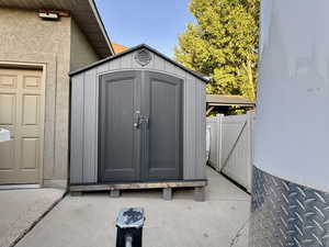 View of shed with a gate