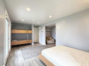 Bedroom with wood finished floors and recessed lighting