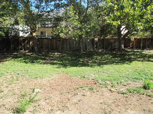 View of fenced backyard