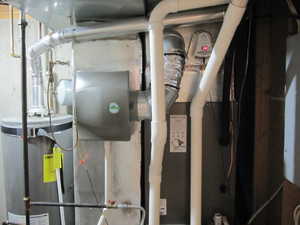 Utility room featuring gas water heater