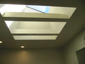 Detailed view of recessed lighting and a skylight