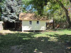 View of shed featuring a fenced backyard