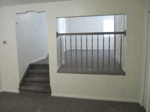 Stairs featuring carpet and baseboards