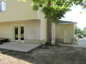 Rear view of property with french doors and a patio
