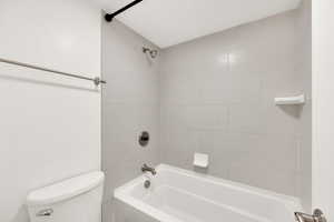 Full bathroom featuring  shower combination and toilet