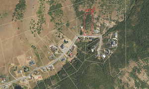 Aerial map of property and surrounding area with property parcel outlined