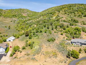 View of subject property featuring a mountainous background