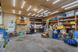 Garage with a workshop area and a garage door opener