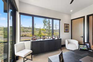 Home office featuring light wood finished floors, recessed lighting, and ceiling fan