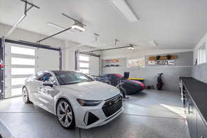 Garage featuring a garage door opener