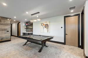 Game room featuring recessed lighting, light colored carpet, bar with sink, and pool table
