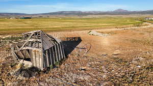 View of mountain background featuring rural landscape