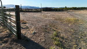 View of yard featuring a rural view and a mountain view