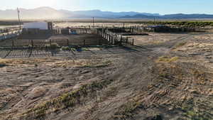View of yard featuring a view of countryside, a mountain view, and an outbuilding