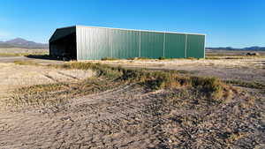 View of pole building featuring a mountain view and a rural view