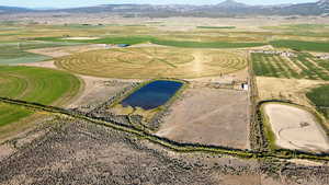 Aerial view of property's location with a mountainous background and rural landscape