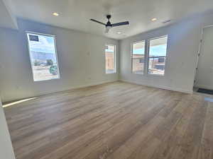 Spare room featuring recessed lighting, light wood-style floors, and a ceiling fan