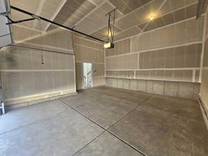 Garage featuring a garage door opener