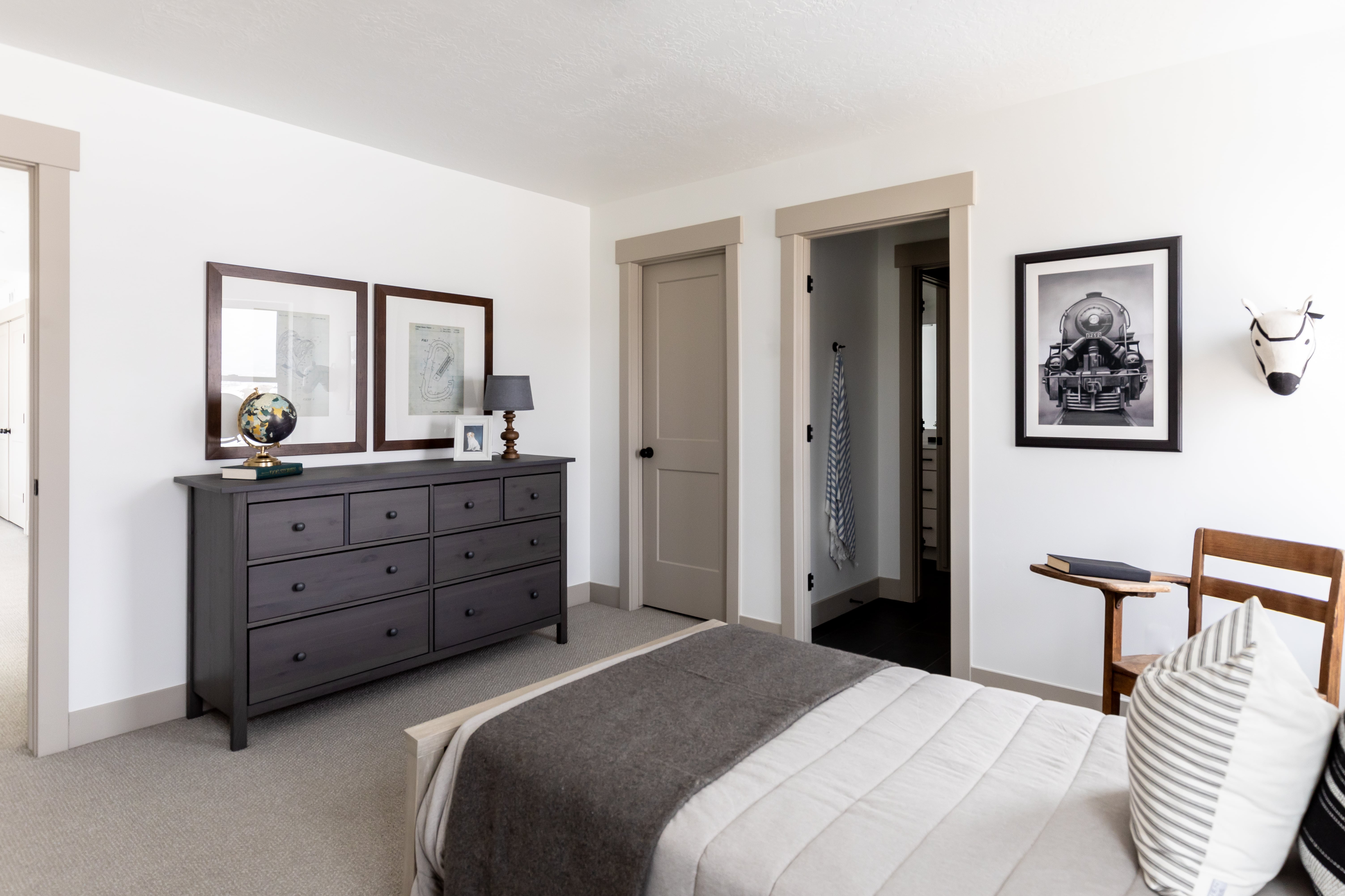 Bedroom featuring carpet floors and connected bathroom