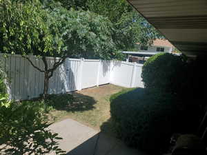 View of fenced backyard