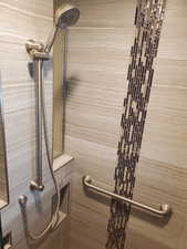 Full bathroom with tiled shower