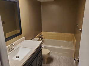 Full bathroom featuring a bath and vanity