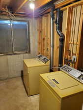 Washroom featuring separate washer and dryer