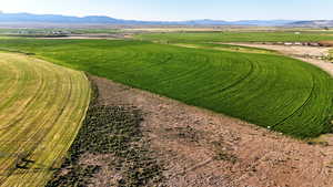 Overview of rural landscape featuring a mountain backdrop