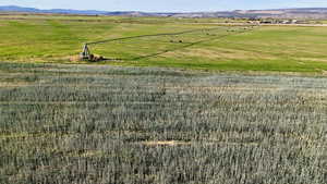 View of rural area featuring agricultural land and a mountain backdrop