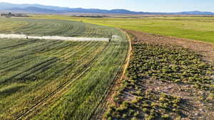 Aerial view of sparsely populated area with a mountainous background