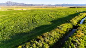 Overview of rural landscape with a mountain backdrop