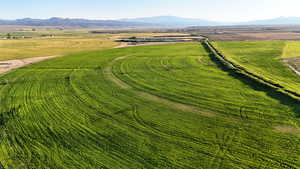 Overview of rural landscape featuring a mountain backdrop